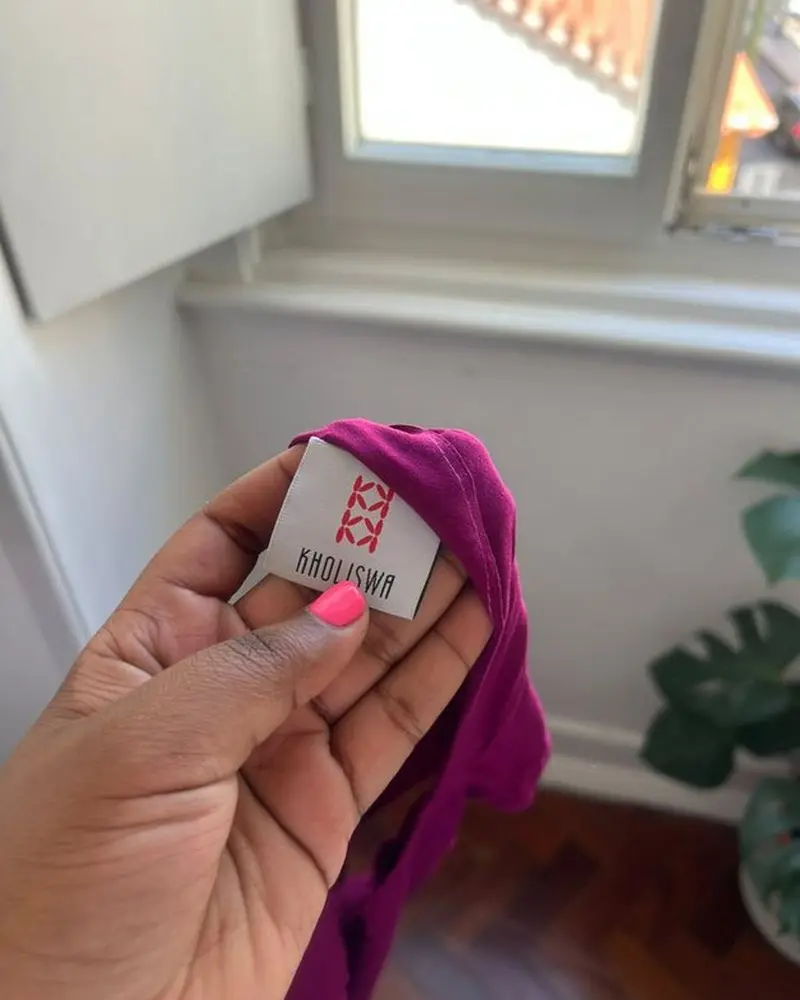 The Kholiswa label sewn into a garment